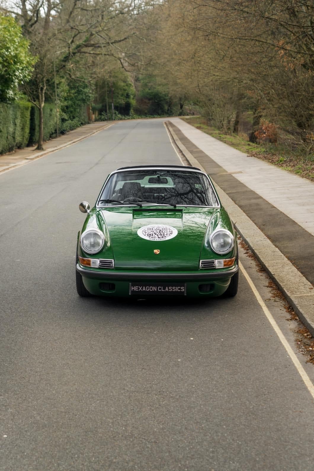 Project 967 head-on down a tree-lined road
