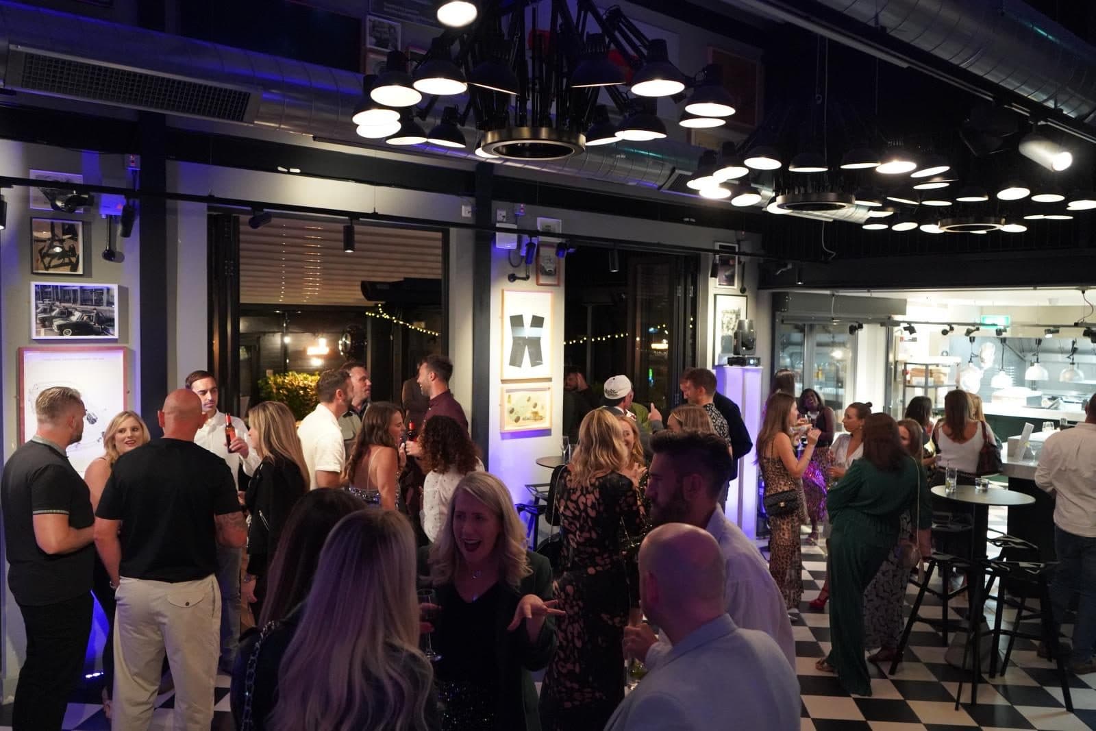 Guests under the hexagon lights